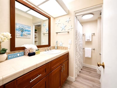 The bathroom offers a bright, functional space to prepare for beach days, sunset dinners, and everything in between