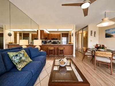 The bright, open-concept living space offers plenty of room to gather, relax, and plan your next island adventure