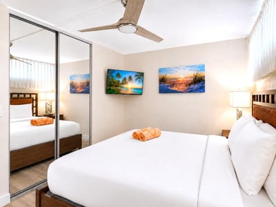 The serene primary bedroom offers a peaceful retreat in the heart of Papakea Resort PKD-204