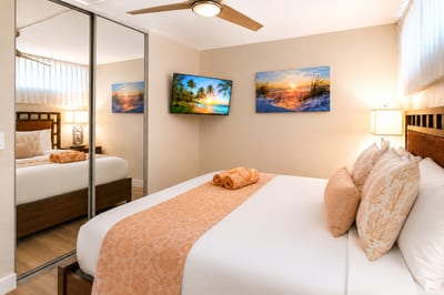 The serene primary bedroom offers a peaceful retreat in the heart of Papakea Resort PKD-204