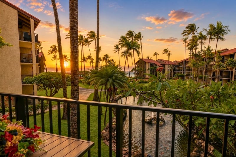Experience Maui's legendary sunsets from your private lanai, where swaying palms and the Pacific Ocean create an unforgettable evening backdrop PKD-204