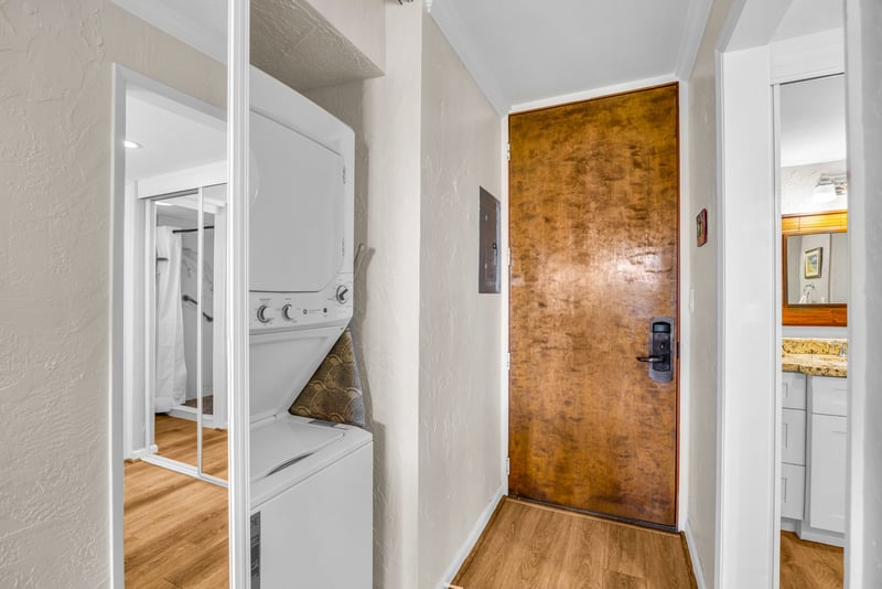 An in-unit stacked washer and dryer adds everyday convenience to your island stay