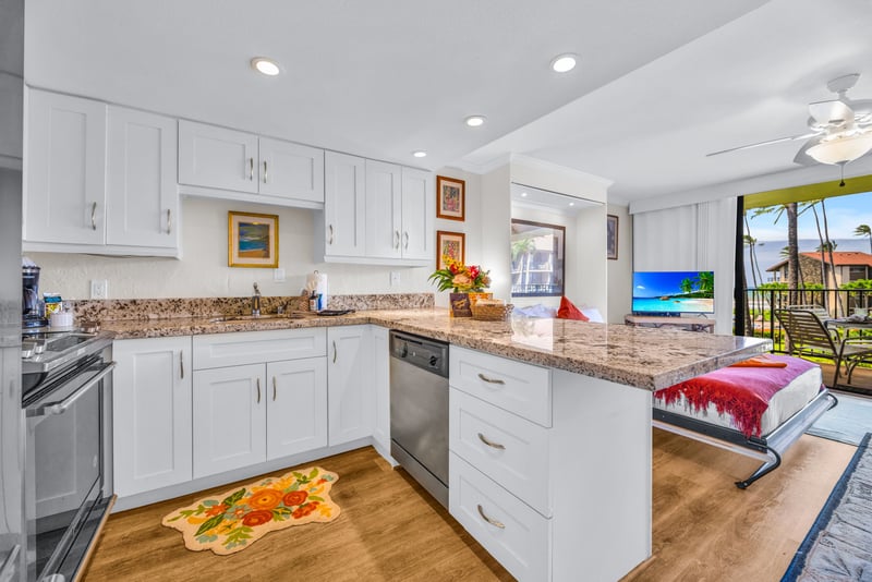 The fully equipped kitchen features ample space for cooking