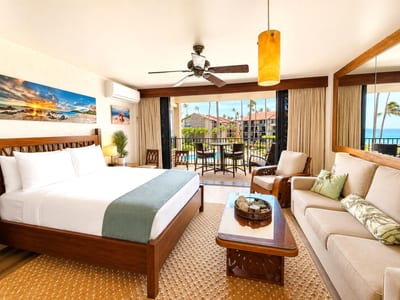 The sliding glass doors open up to the spacious lanai and ocean views