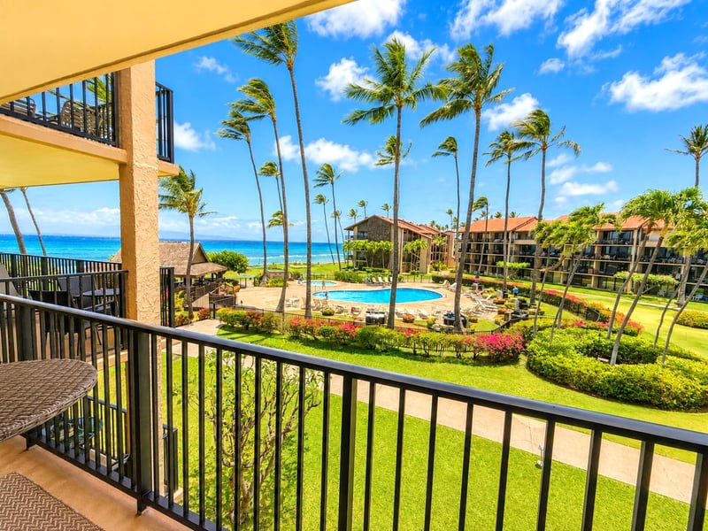 Your view features the ocean, palms, and open sky framing the coastline from the lanai