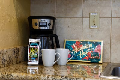 Start your mornings Maui-style with tropical coffee, a cozy setup, and the sweet scent of paradise in your cup
