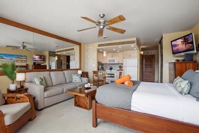 From mirrored light to rich island woods, this guest space flows with style, sun, and restful rhythm