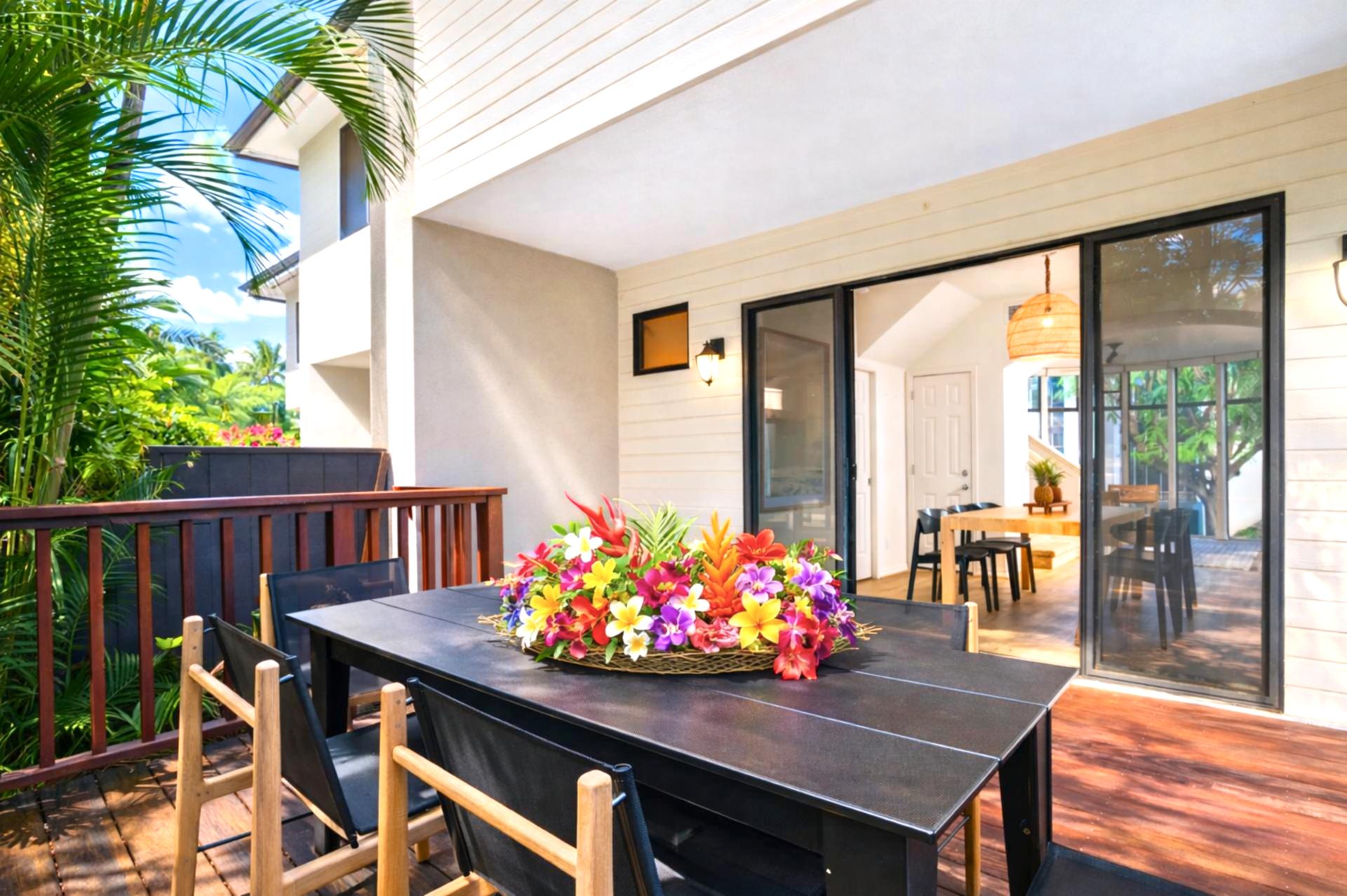  Savor meals al fresco on this private lanai, where modern comfort meets a tranquil canopy of island greenery  