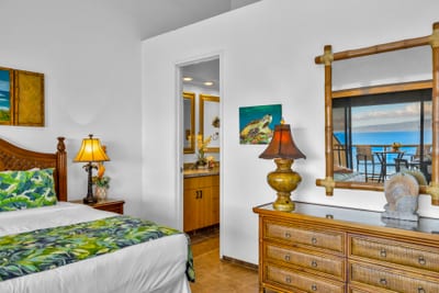 Whether your Master Bed is dressed with pink pillows or the tropical design, this bedroom not only features lots of space, but a gorgeous view and private lanai.