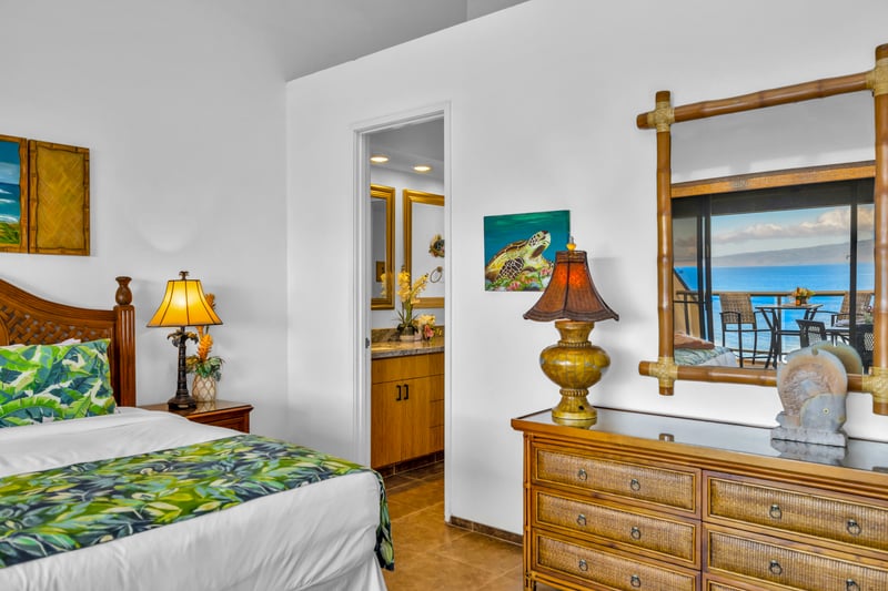 Whether your Master Bed is dressed with pink pillows or the tropical design, this bedroom not only features lots of space, but a gorgeous view and private lanai.