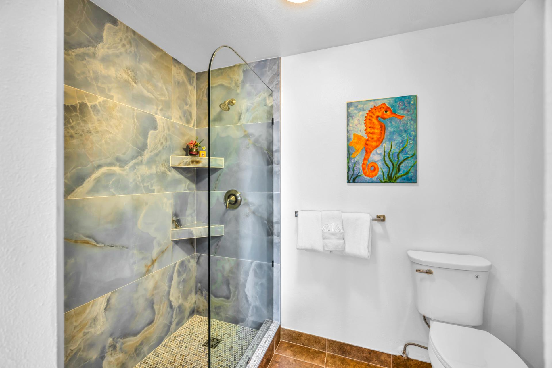 Your bathroom features a walk-in shower and modern touches.