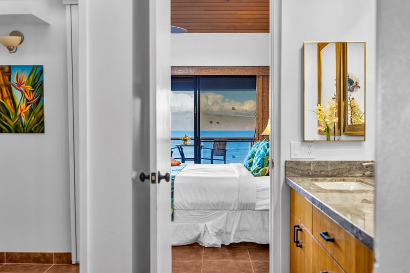 Dual vanities and rich wood cabinetry add style and function to the primary en suite.