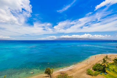 Soak in endless turquoise blues and soft golden sand from your lanai—paradise is truly steps from your door