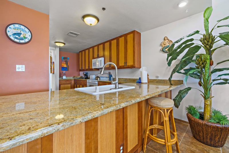 The kitchen’s bar seating lets guests chat or snack while meals are being prepared.