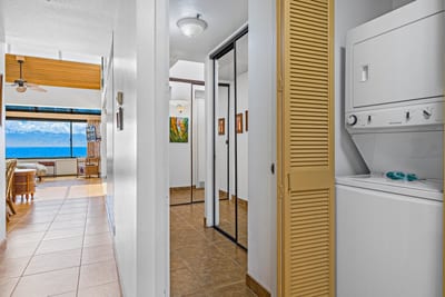 Keep beachwear and vacation outfits clean and ready to wear thanks to the private laundry setup in the closet