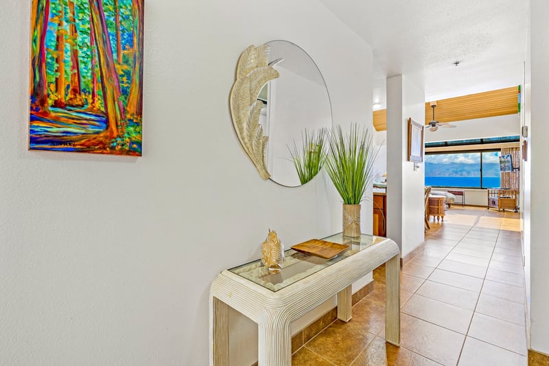 Let the leafy mirror, glowing tile, and pop of color set the mood—your joyful island adventure starts right here!