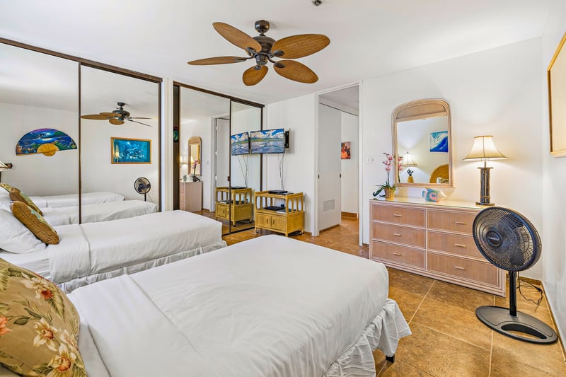 This cozy Twin bedroom has everything needed for a restful night, including a fan and nearby bath access.