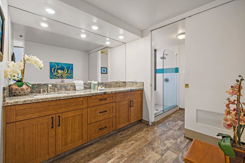 Begin and end your day in this tranquil bathroom, where organic textures and soft lighting offer peaceful luxury