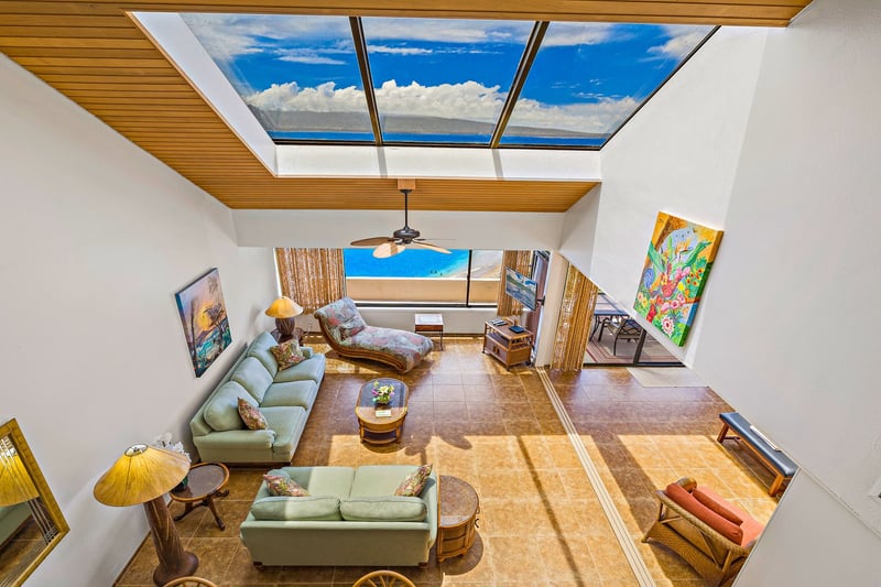 Bathed in sunlight from grand skylights above, your living room opens to endless views and oceans breezes.