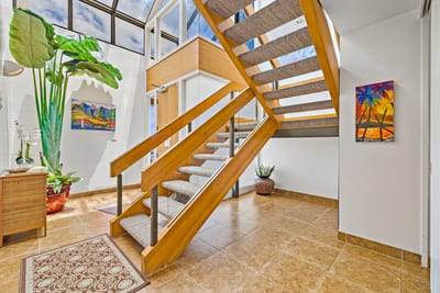 Let the natural light and playful pops of color turn every trip upstairs into a mini tropical adventure