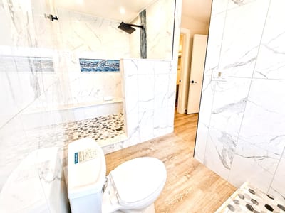 A well-appointed primary bathroom with a spa-like feel