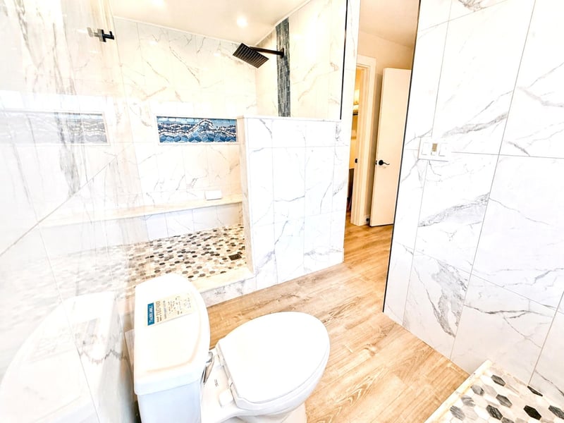 A well-appointed primary bathroom with a spa-like feel