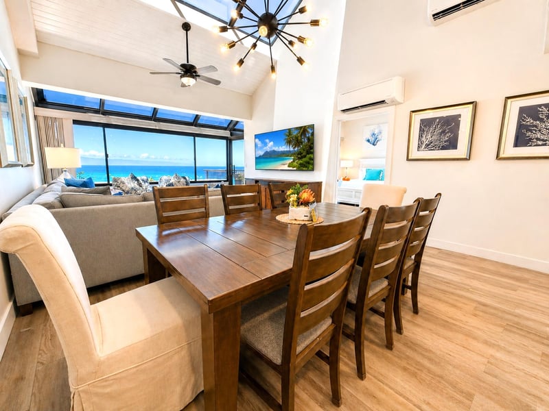 The dining area seats the group comfortably, with ocean views making every meal feel like an occasion