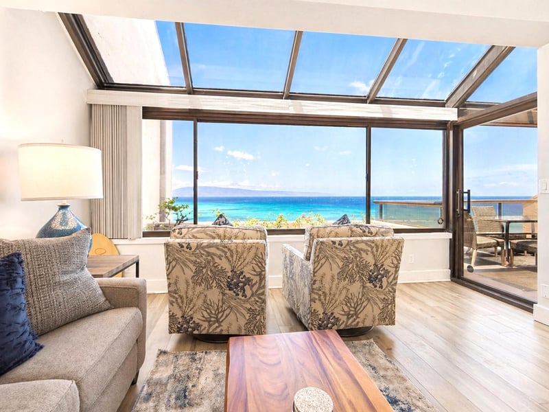 Soft furnishings and ocean-facing windows create a calm, inviting space to start and end each day.