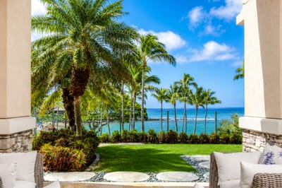 Beneath sunlit fronds and coastal calm, elegance meets ease