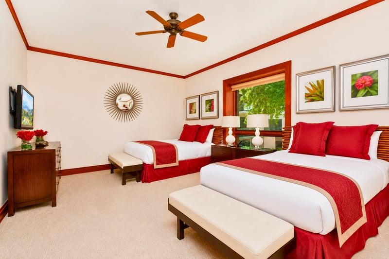 Spacious and welcoming, this guest room offers comfort and vibrant island charm