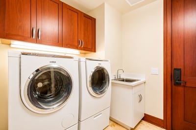 Convenient in-villa laundry room with modern washer and dryer, perfect for extended stays