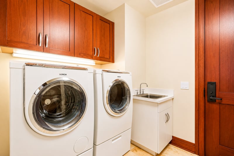 Convenient in-villa laundry room with modern washer and dryer, perfect for extended stays MON-1303