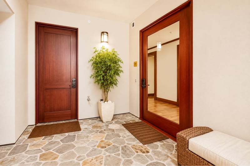 Step into your Maui escape through this inviting entryway with warm wood and natural stone MON-1303
