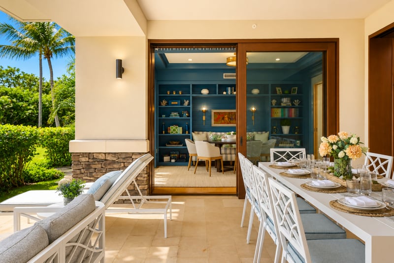 Sunset lanai dining at The Resort at Kapalua Bay MON-2206 — table for eight opening directly into the home's colorful den and library MON-2206