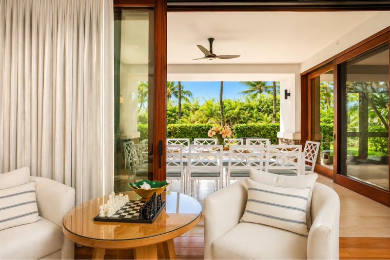 Hallway art nook at The Resort at Kapalua Bay MON-2206 — a striking blue abstract painting sets the tone for the home's coastal palette MON-2206
