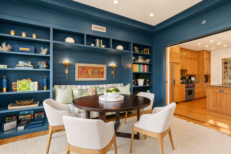 Den bookshelves at The Resort at Kapalua Bay MON-2206 — curated built-in shelving and open sightlines through to the kitchen MON-2206
