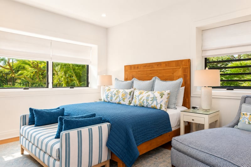 Guest bedroom at The Resort at Kapalua Bay MON-2206 — wood headboard king bed with garden views through dual windows MON-2206