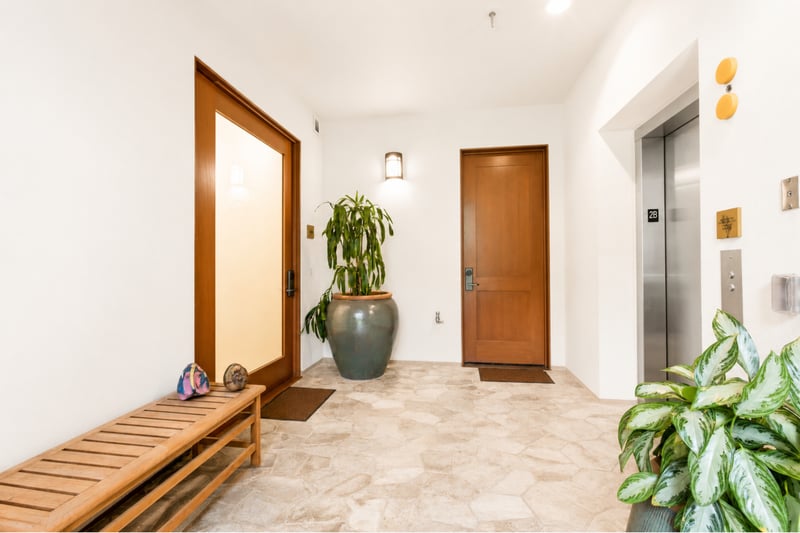 Private entry foyer at The Resort at Kapalua Bay MON-2206 — glass-paneled front door with direct elevator access to unit 2B MON-2206