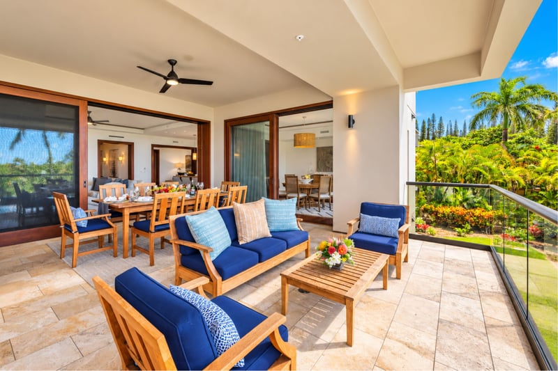 Expansive lanai with sofa lounge and outdoor dining opening to the living and dining rooms