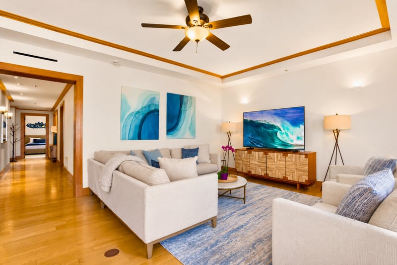 Living room at The Resort at Kapalua Bay MON-6301 — sectional sofa, ocean-inspired art, and smart TV for relaxed evenings in