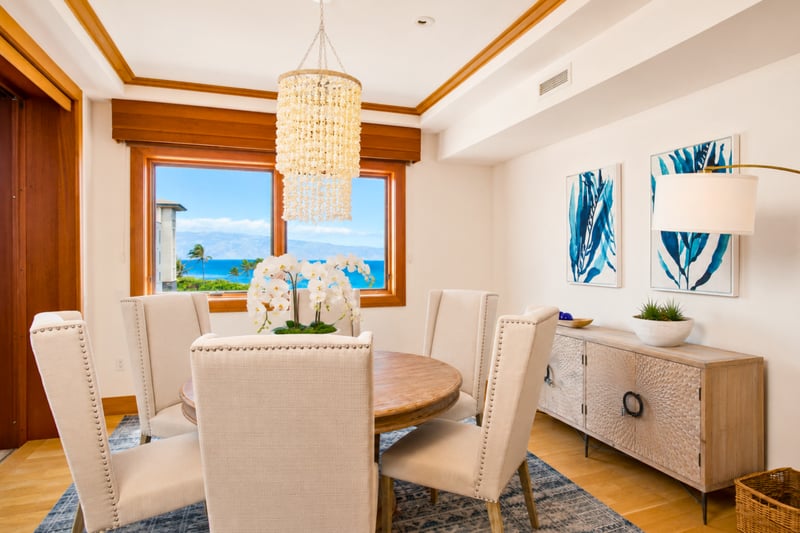 Kitchen island at The Resort at Kapalua Bay MON-6301 — full-size fridge, gas range, and open sightlines to both living areas