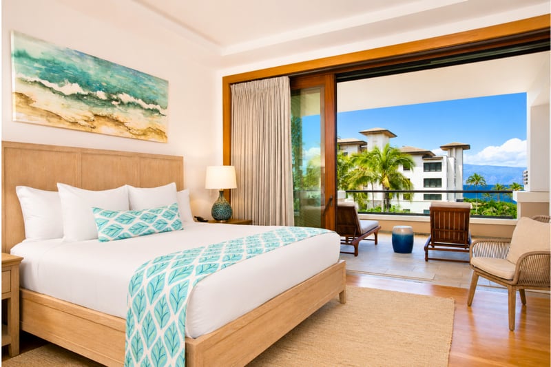 Primary bedroom at The Resort at Kapalua Bay MON-6301 — king bed with private lanai access and ocean views