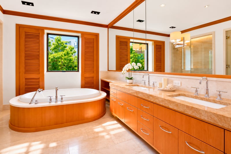 Primary bathroom at The Resort at Kapalua Bay MON-6301 — soaking tub, dual vanity, and glass walk-in shower