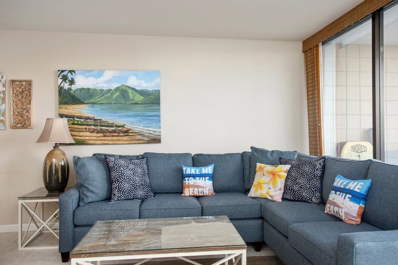 This inviting living room blends island elegance with oceanfront views, perfect for unwinding or gathering with friends
