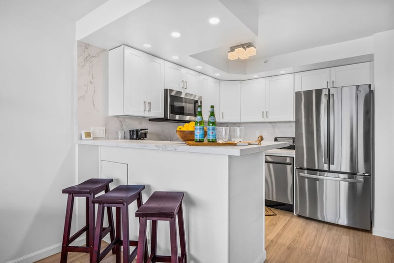 The kitchen features ample counter space and modern appliances for longer stays