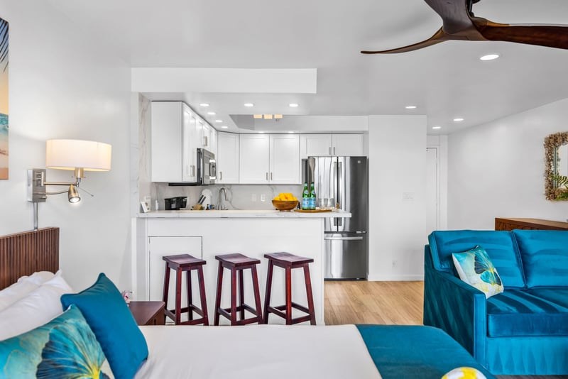 A breakfast bar with seating for three makes casual mornings easy, right off the fully equipped kitchen