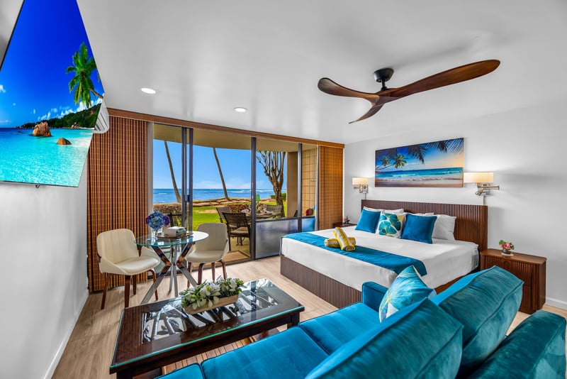 The recently updated living space features coastal decor 