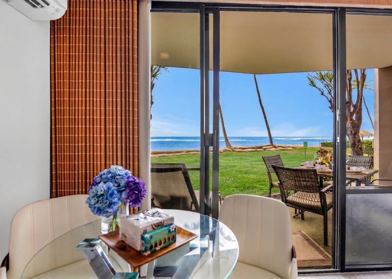 Wide sliding doors open the balcony to warm trade winds