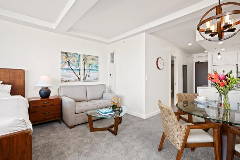 Sip coffee in a cozy lounge by the bed as island breezes carry your daydreams beyond the glass balcony rail