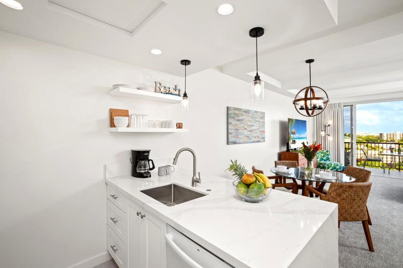 Kitchen opens into dining area with seamless condo layout.